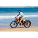 VAMOS El Hefe 500W 48V 2Ah Electric Bike in Black on Beach View